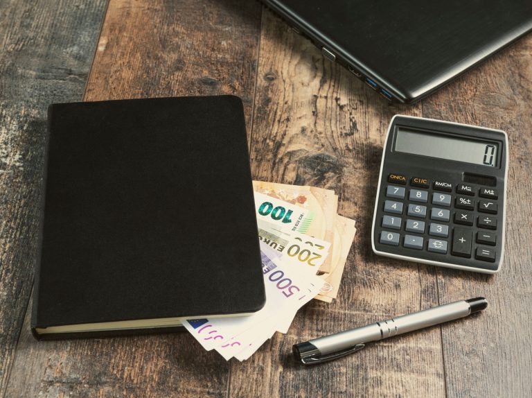 Accounting,Book,Fragment,Of,An,Account,Device,With,Euro,Banknotes